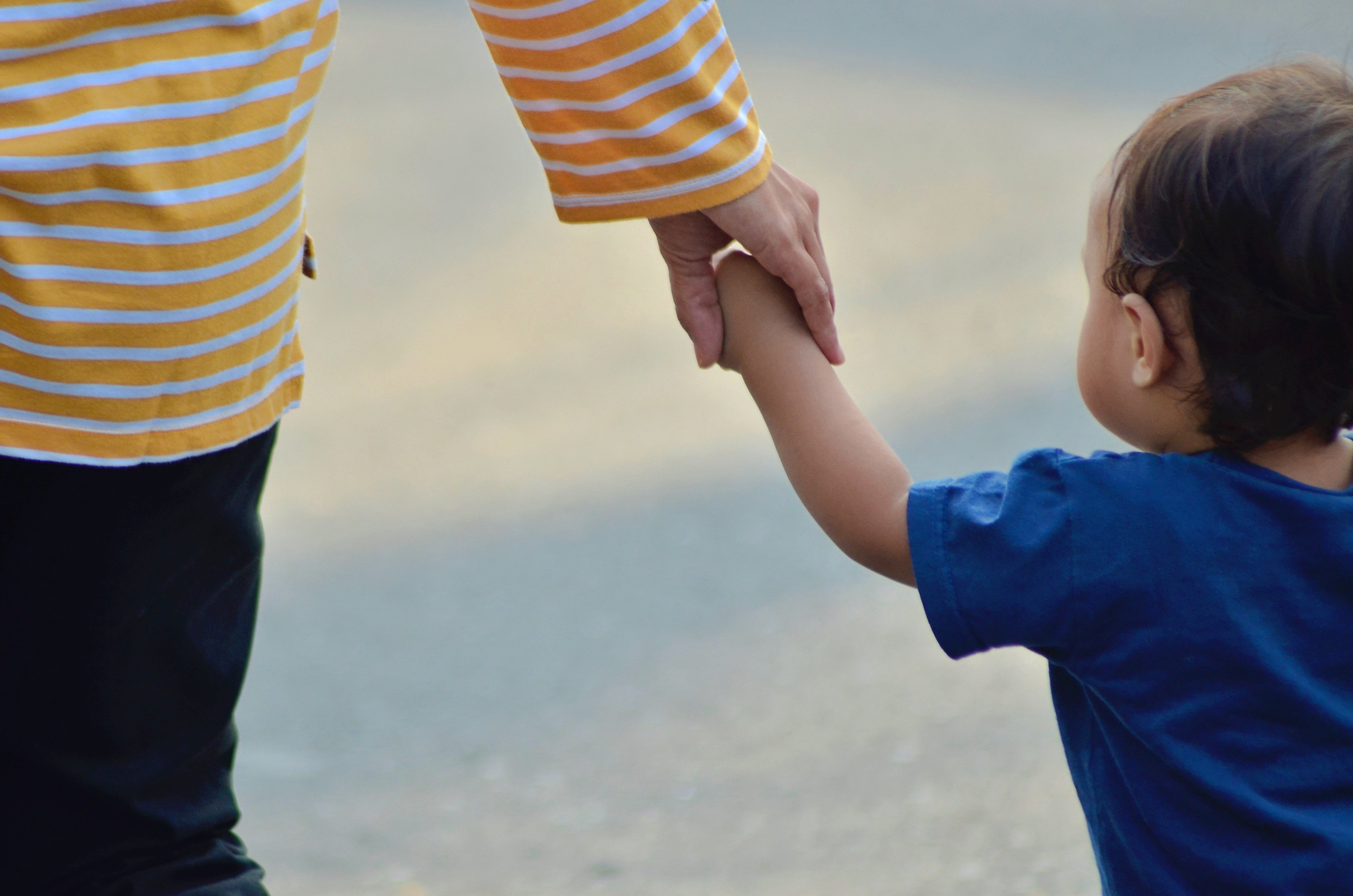 Family holding hands outdoors